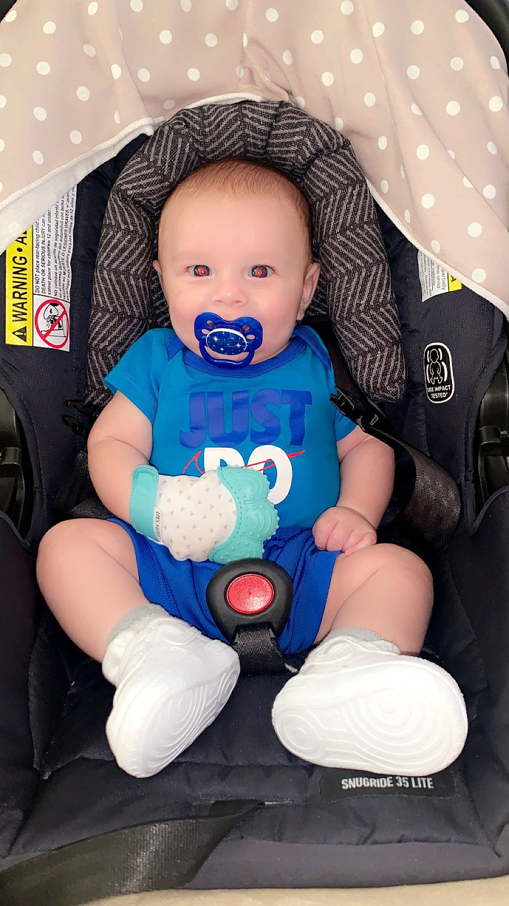 Kayden is registered to the contest to win money with this photo: arm, baby, baby_carriage, baby_in_car_seat, baby_products, baby_safety, baby_sleeping, baby_toddler_clothing, child, comfort, electric_blue, finger, flash_photography, person, product, sitting, sleeve, smile, t_shirt, textile