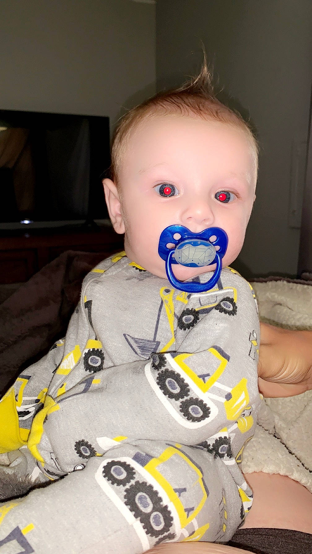 Kayden is registered to the contest to win money with this photo: baby, baby_products, baby_toddler_clothing, cheek, child, electric_blue, eyelash, fun, hairstyle, happy, head, neck, nose, person, personal_protective_equipment, product, sitting, skin, sleeve, t_shirt