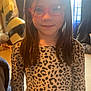 Kylie joined the competition — help win amazing prizes! child, girl, glasses, long_hair, leopard_print, shirt, indoor, window, sunlight, warm_light, portrait, smile, standing, young, casual_clothing, person, home, daylight, fashion, happy
