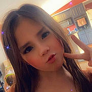 Kylie joined the competition — help win amazing prizes! child, girl, peace_sign, posing, long_hair, orange_dress, sparkle_filter, indoor, kitchen, cabinet, ceiling_fan, lighting, playful, pout, portrait, young, smiling_eyes, casual, home, person
