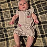 Journee joined the competition — help win amazing prizes! baby, infant, child, plaid_blanket, striped_clothing, headband, hello_kitty, romper, barefoot, laying_down, curious_expression, indoors, soft_lighting, cute, adorable, person, face, skin, small_hands, small_feet