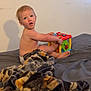 Malachi joined the competition — help win amazing prizes! baby, bed, blanket, child, colorful, cube, curious, diaper, expression, face, furniture, indoor, person, play, room, shadow, skin, toddler, toy, young
