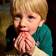 Charlie joined the competition — help win amazing prizes! child, blonde_hair, green_eyes, hands, indoor, curious, messy_face, long_sleeves, sweater, portrait, close_up, young, person, casual_clothing, looking_up, cute, expression, light_shadow, skin, face