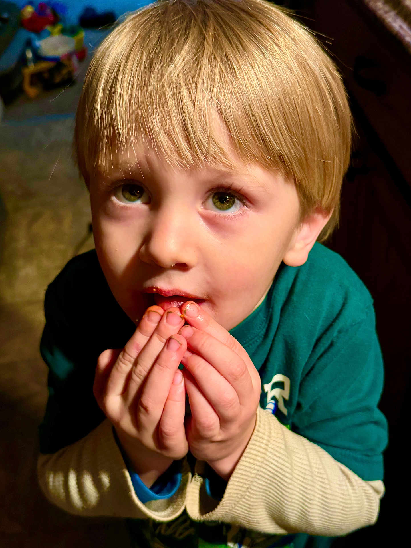 Charlie joined the competition — help win amazing prizes! child, blonde_hair, green_eyes, hands, indoor, curious, messy_face, long_sleeves, sweater, portrait, close_up, young, person, casual_clothing, looking_up, cute, expression, light_shadow, skin, face