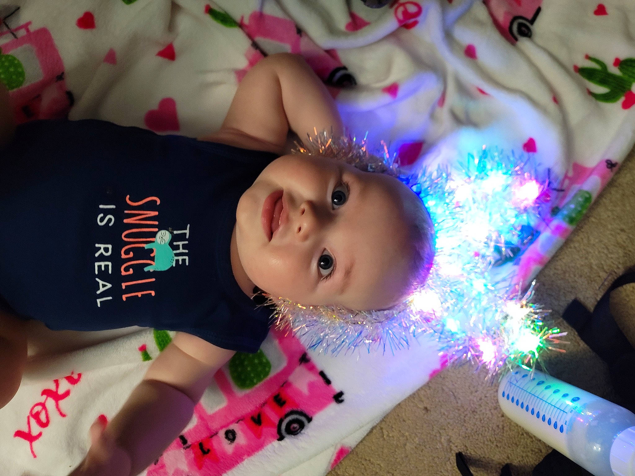 Leland joined the competition — help win amazing prizes! beauty, child, christmas, christmas_ornament, event, fun, happy, headwear, holiday, magenta, ornament, party, party_supply, pattern, person, pink, skin, textile, toddler