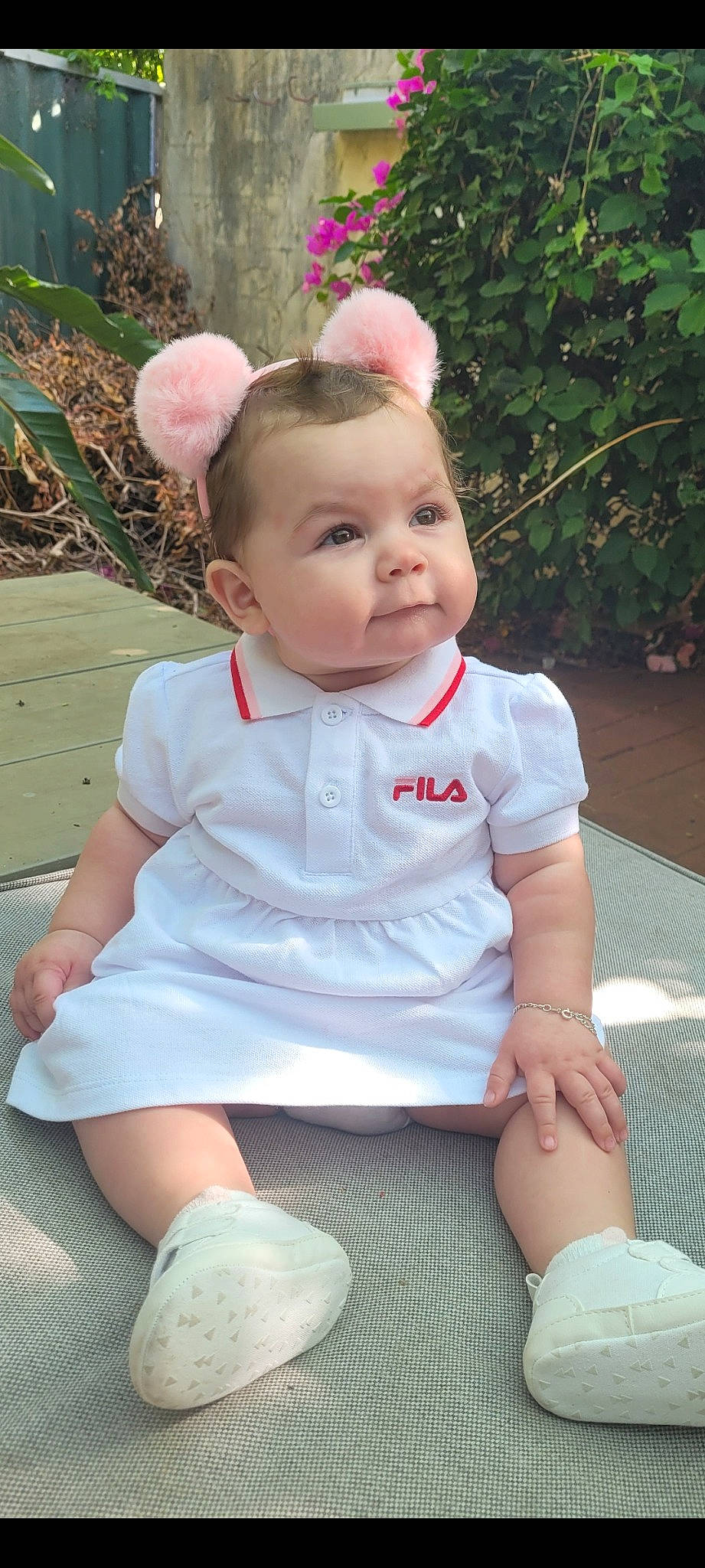 Honey joined the competition — help win amazing prizes! baby, baby_toddler_clothing, cheek, child, eye, fashion_accessory, grass, hairstyle, happy, headband, leg, pattern, person, pink, plant, sitting, skin, sleeve, sock, toddler