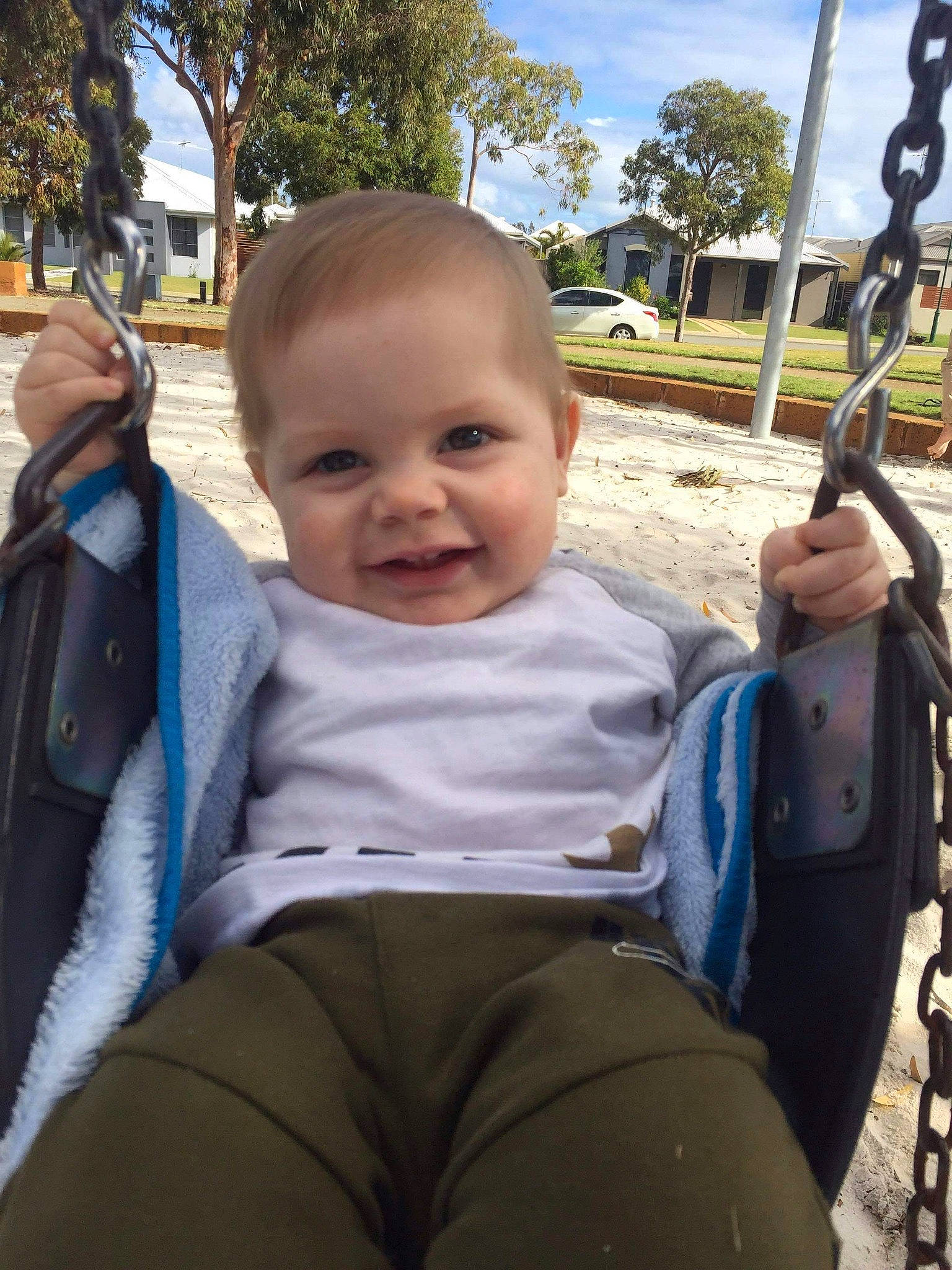 Emmett-archer is registered to the contest to win money with this photo: baby, child, joy, leg, person, play, playground, skin, smile, swing, toddler, tree, vacation