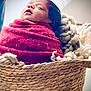 baby, basket, blanket, child, cozy, cute, face, head, indoors, infant, newborn, peaceful, portrait, resting, sleeping, soft, texture, warm, woven, wrapped