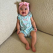 Brinley joined the competition — help win amazing prizes! baby, child, smiling, headband, pink, romper, blue, butterfly, sitting, couch, beige, texture, happy, cute, infant, portrait, indoors, people, legs, feet