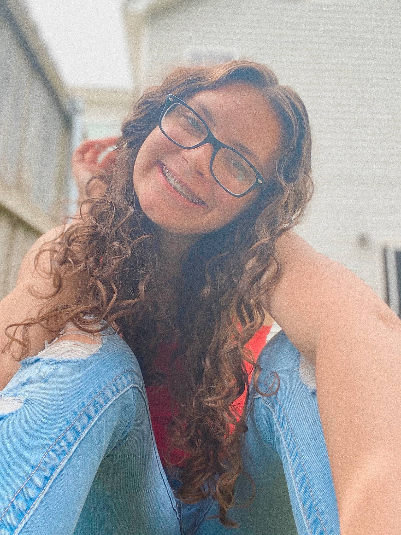 Haley is registered to the contest to win money with this photo: beauty, blue, brown_hair, chin, eyebrow, eyewear, face, facial_expression, forehead, glasses, hair, hairstyle, joy, lip, long_hair, nose, person, red, shoulder, skin