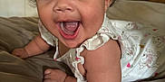 Eliza joined the competition — help win amazing prizes! baby, child, curly_hair, smiling, happy, indoor, bed, clothing, person, face, expression, sleeveless, furniture, shelf, door, skin, tongue, eyes, mouth, infant