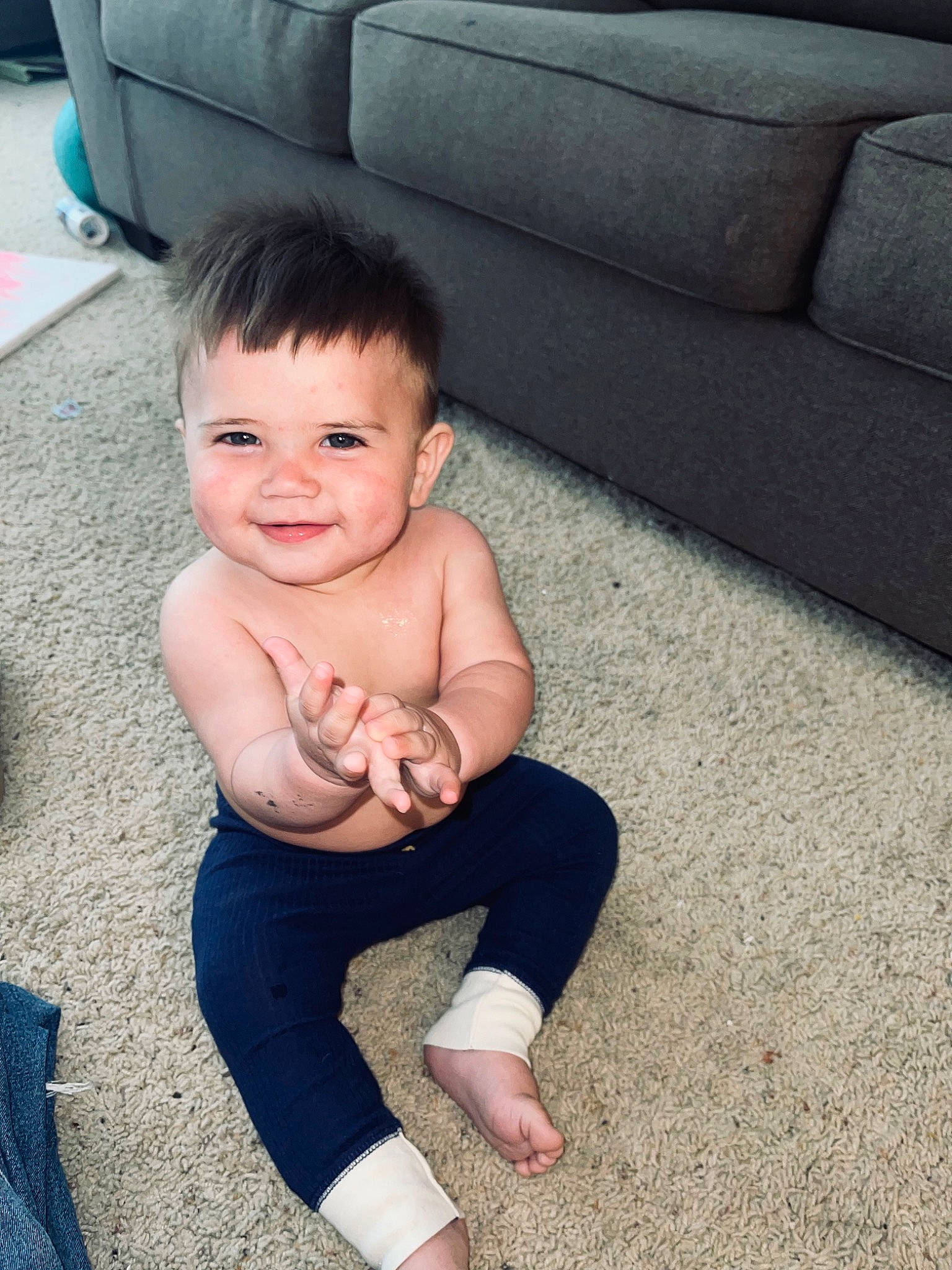 Alonzo is registered to the contest to win money with this photo: baby, baby_toddler_clothing, barefoot, comfort, couch, eye, finger, floor, flooring, foot, grass, happy, human_body, joy, leg, person, skin, smile, thigh, thumb