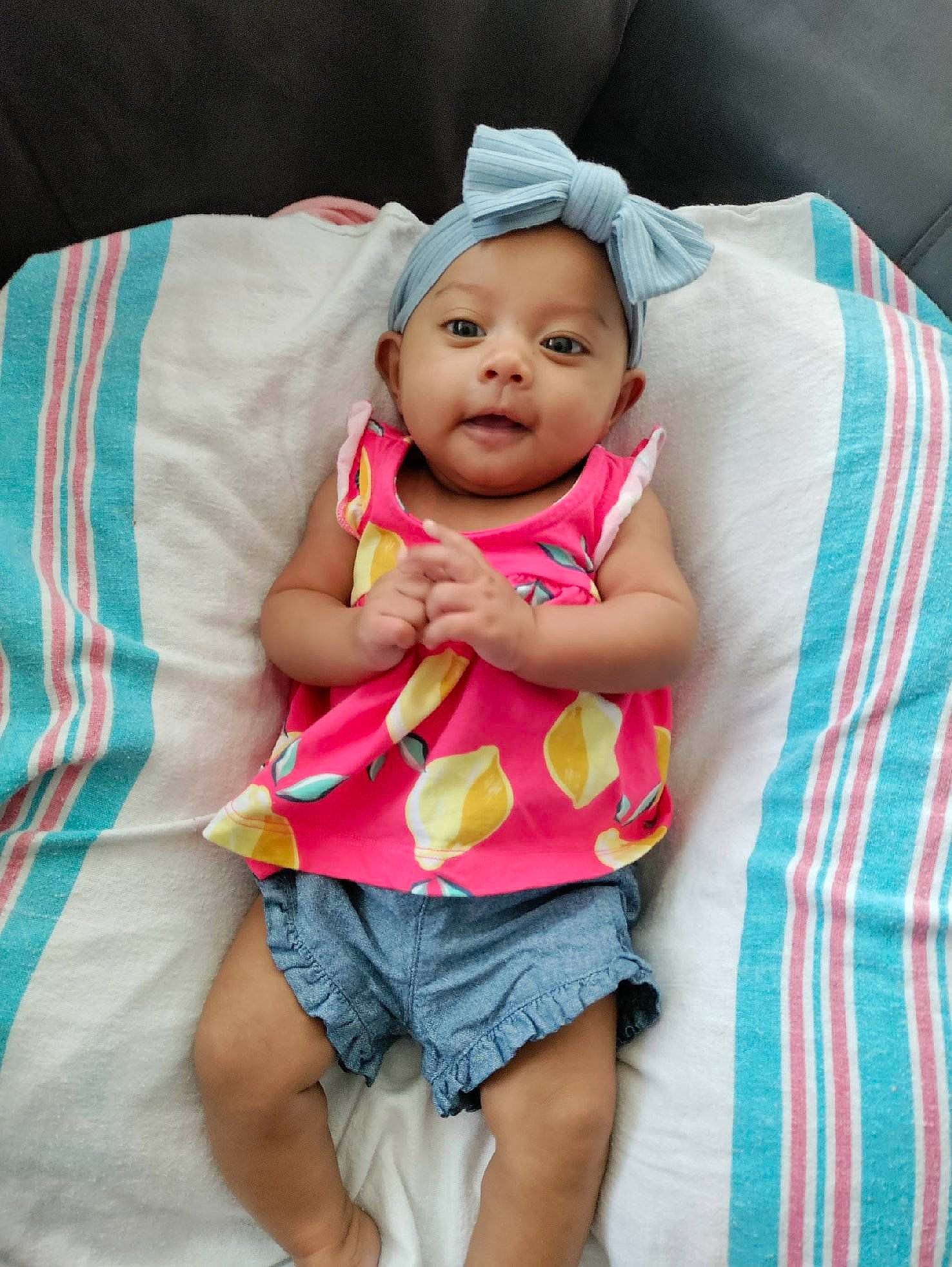 Ariah joined the competition — help win amazing prizes! baby, baby_products, baby_toddler_clothing, cheek, comfort, event, eye, happy, headwear, human_leg, linens, magenta, pattern, person, pink, plaid, skin, sleeve, t_shirt, tartan