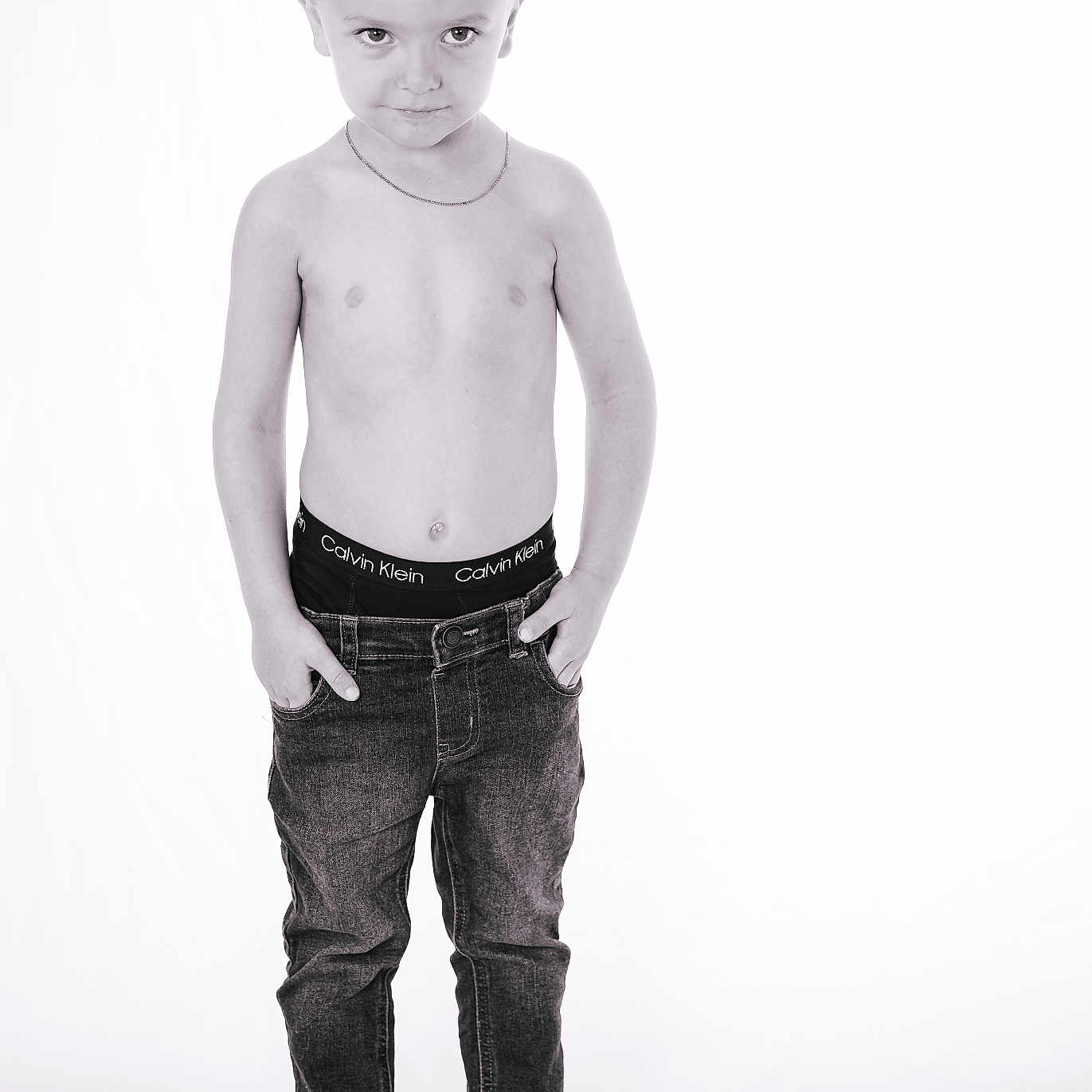 Hardin is registered to the contest to win money with this photo: accessories, bodypart, boy, child, clothing, face, finger, hand, happy, head, jeans, jewelry, male, necklace, pants, person, photography, portrait, smile, standing