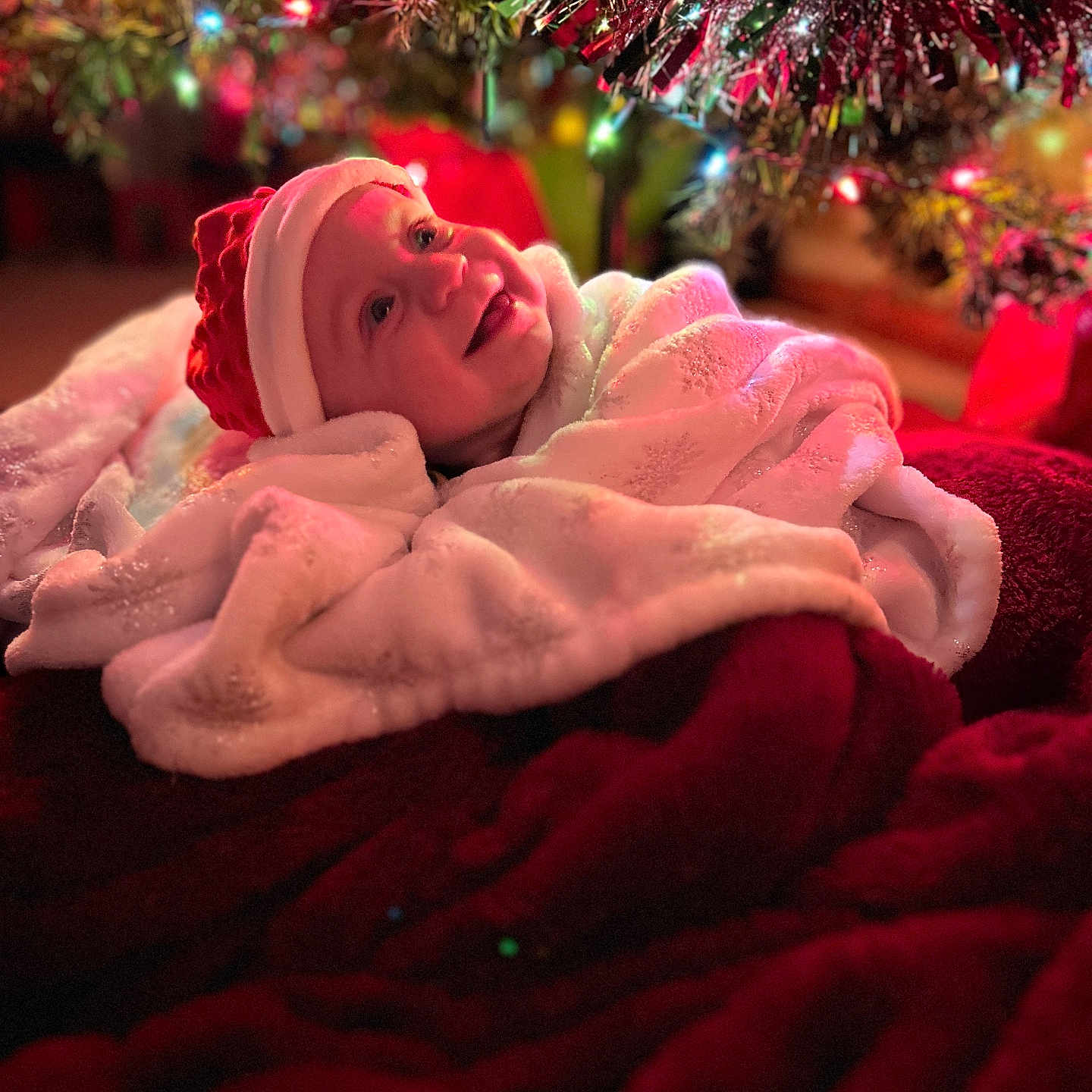 Layne is registered to the contest to win money with this photo: accessories, baby, blanket, bodypart, bonnet, cap, clothing, face, flower, hat, head, lighting, newborn, person, photography, plant, portrait, quilt, rose, towel