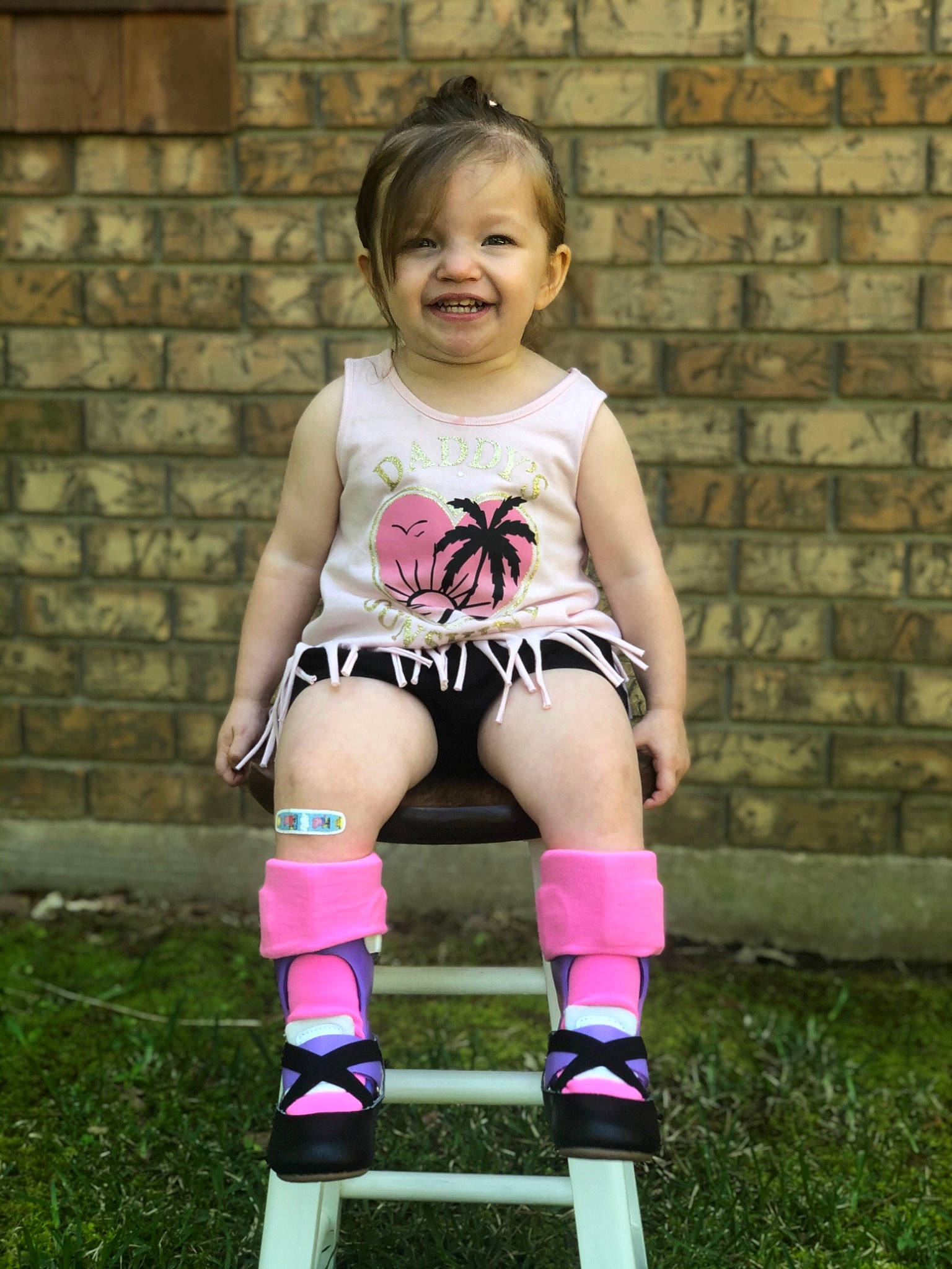 Annabel is registered to the contest to win money with this photo: baby_toddler_clothing, child, child_model, footwear, human_leg, joint, joy, knee, knee_pad, leg, person, photography, pink, play, roller_skates, shoe, shorts, sports_gear, thigh, toddler