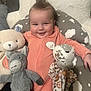 Amelia is registered to the contest to win money with this photo: baby, ball, blanket, couch, cushion, face, football, furniture, happy, head, homedecor, laughing, person, photography, pillow, plush, portrait, smile, teddybear, toy