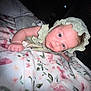 Amelia joined the competition — help win amazing prizes! baby, bed, bedroom, blanket, bonnet, cap, clothing, dress, face, furniture, hat, head, indoors, newborn, person, photography, portrait, quilt, room, sunhat