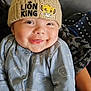 Theo-John joined the competition — help win amazing prizes! baby, smiling, hat, knit_hat, lion_king, onesie, blue_clothing, bear_pattern, infant, cute, child, face, happy, hand, person, portrait, indoors, warm_clothing, soft_texture, holding