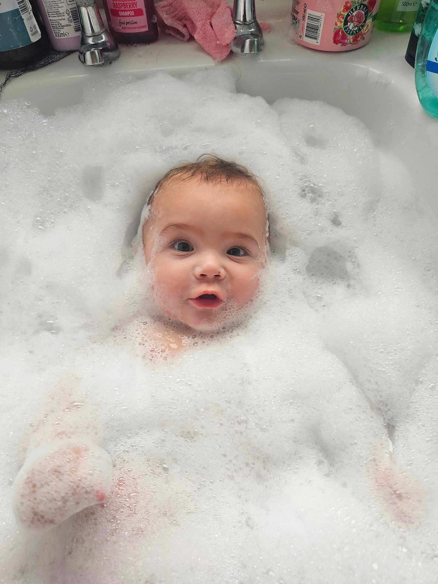 Theo-John is registered to the contest to win money with this photo: baby, bath, bubbles, foam, sink, face, child, water, soap, cleaning, cute, pink, shampoo, washcloth, toddler, skin, head, expression, happy, bathtub