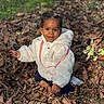Naëlys participe au concours pour gagner de l'argent avec cette photo : child, toddler, autumn, leaves, outdoor, smile, white_jacket, grass, nature, playful, happy, seasonal, fall, park, cute, young_child, casual_clothing, daylight, portrait, sitting