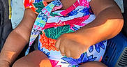 Naioir joined the competition — help win amazing prizes! baby, child, infant, bow, colorful_clothing, floral_pattern, seat, cushion, sunlight, skin, face, legs, arms, curly_hair, portrait, indoors, comfort, cute, expression, person