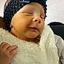 baby, bow, child, closed_eyes, cozy, cute, face, fluffy, hand, headband, indoors, infant, newborn, peaceful, portrait, skin, sleeping, soft_light, warm, white_clothing