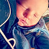 Elias is registered to the contest to win money with this photo: baby, sleeping, infant, blue_clothing, cozy, closeup, face, peaceful, soft_light, newborn, child, portrait, resting, indoors, cute, skin, head, person, calm, tender