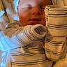 Elias joined the competition — help win amazing prizes! baby, newborn, sleeping, pajamas, hat, striped_clothing, blanket, soft_texture, infant, peaceful, cute, face, closed_eyes, cozy, resting, child, person, indoors, warm, portrait