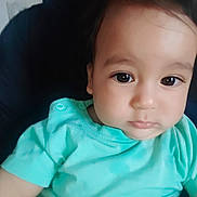 Mohamed Ayoub a rejoint le concours — aidez-le/la à gagner de superbes lots ! baby, calm, child, closeup, clothing, cute, expression, eyes, face, head, holding, human, indoor, infant, person, portrait, sitting, skin, turquoise_shirt, young