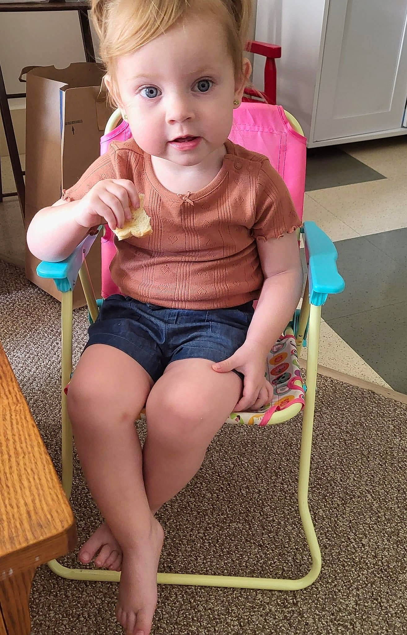 Raelyn is registered to the contest to win money with this photo: baby_toddler_clothing, chair, cheek, chin, clothing, dress, eye, eyelash, face, furniture, hairstyle, head, iris, joint, leg, lip, person, pink, shorts, skin