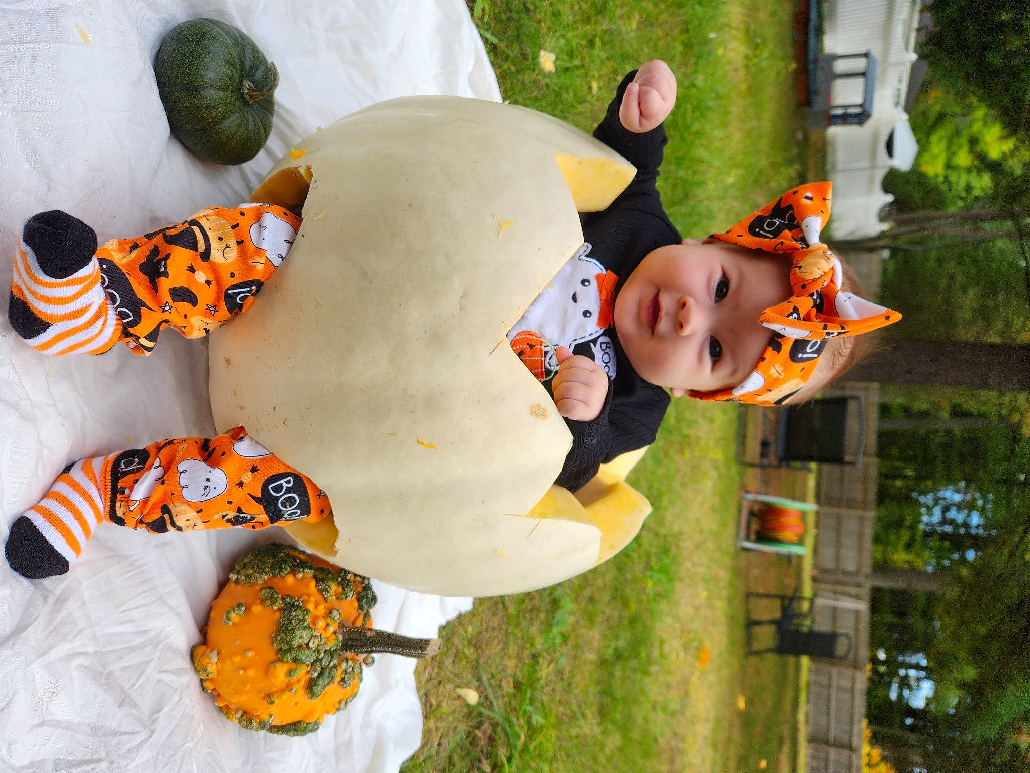 Mariana is registered to the contest to win money with this photo: baby, baby_toddler_clothing, child, fun, grass, green, happy, hat, headgear, headwear, leisure, orange, organism, people, person, plant, product, recreation, smile, toddler