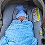 baby, blanket, blue, car_seat, child, clothing, cozy, cute, face, hat, infant, nap, outdoor, person, pom_pom, resting, sleeping, soft, warm, wrapped