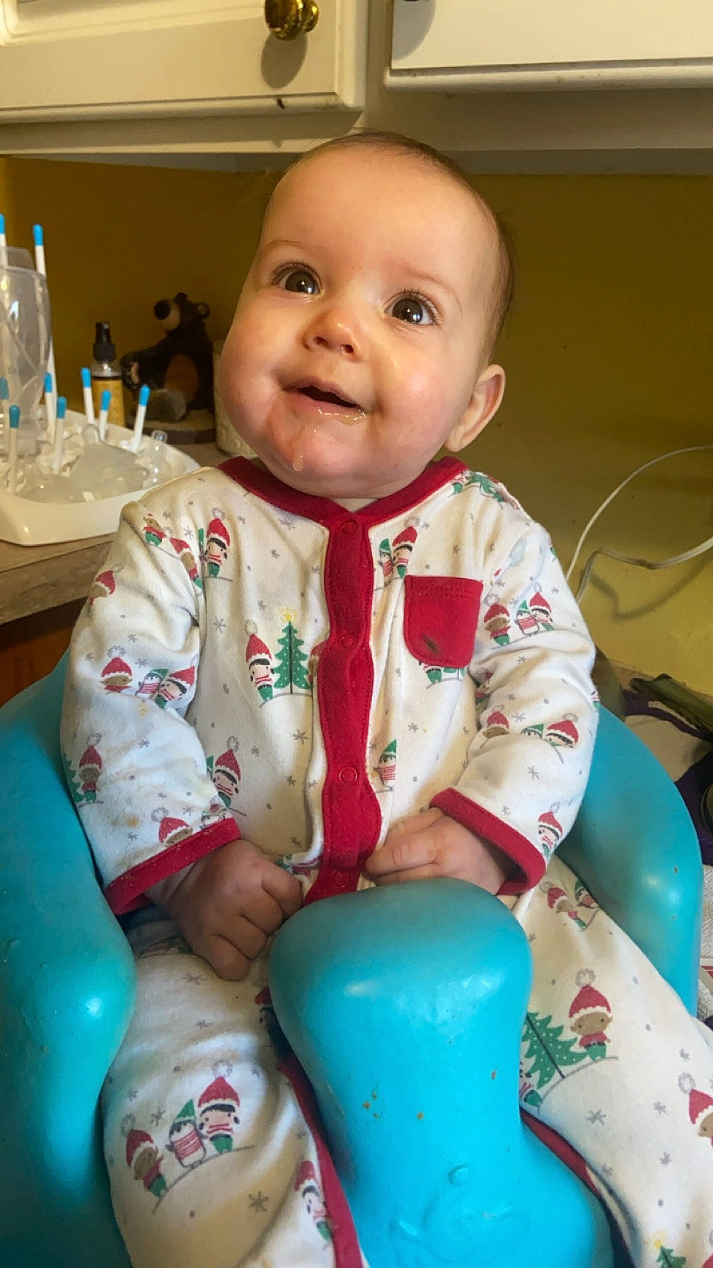 Aria is registered to the contest to win money with this photo: baby, baby_products, baby_toddler_clothing, blue, bottle, chair, cheek, child, drinkware, fun, happy, joy, person, play, porcelain, room, sitting, skin, sleeve, smile