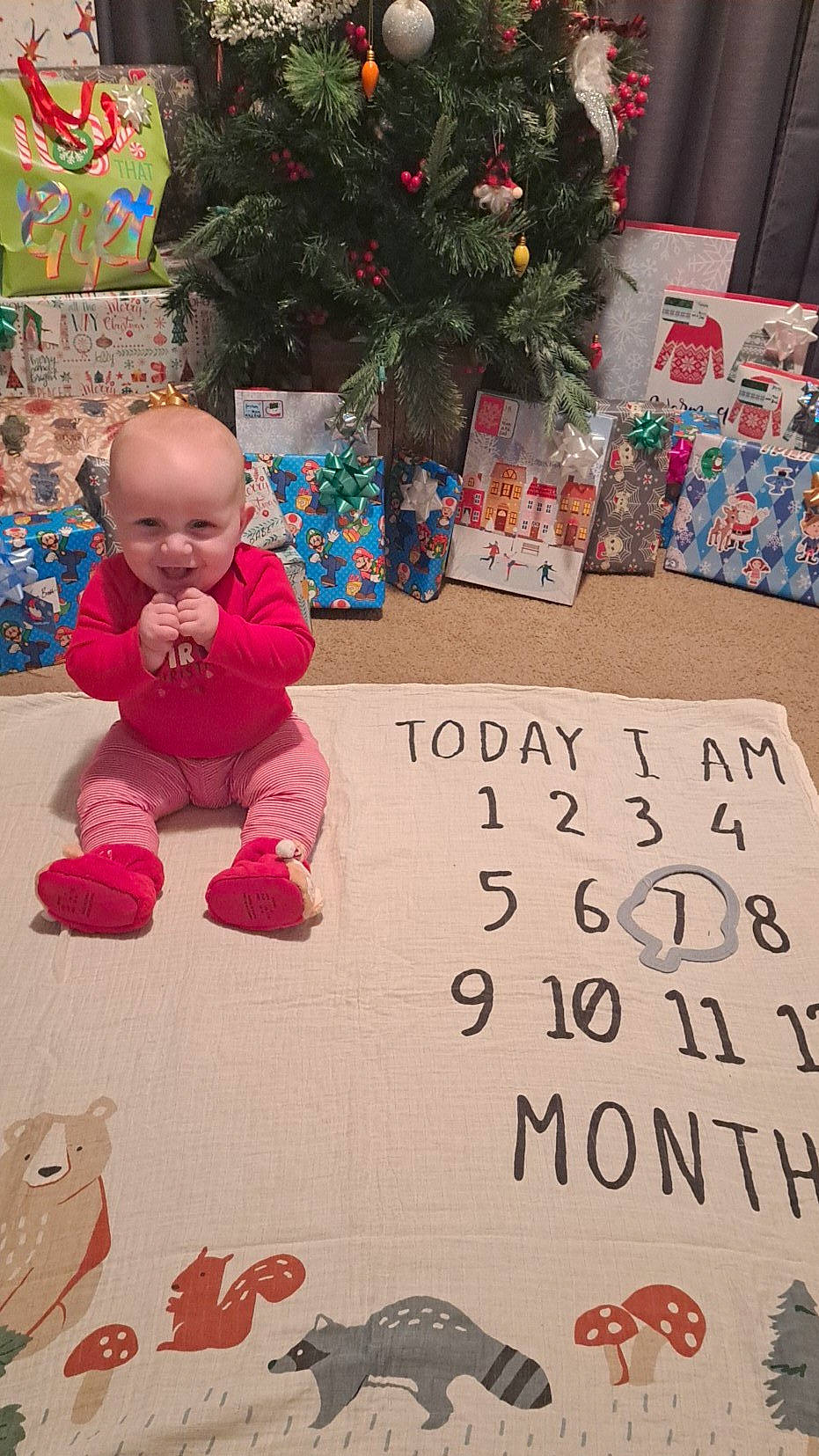 Jaxon joined the competition — help win amazing prizes! art, baby, baby_toddler_clothing, carmine, child, christmas_decoration, christmas_ornament, christmas_tree, event, flooring, font, happy, holiday, joy, pattern, person, play, smile, textile, toddler