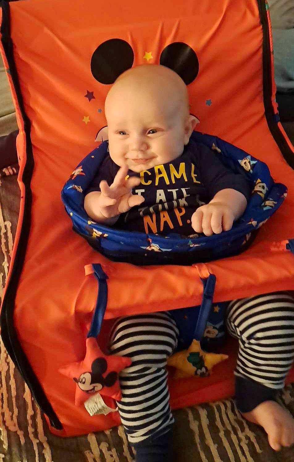 Jaxon is registered to the contest to win money with this photo: baby, baby_carriage, baby_products, baby_safety, baby_toddler_clothing, car_seat, chair, cheek, child, comfort, electric_blue, fun, happy, lap, orange, person, sitting, smile, t_shirt, toddler