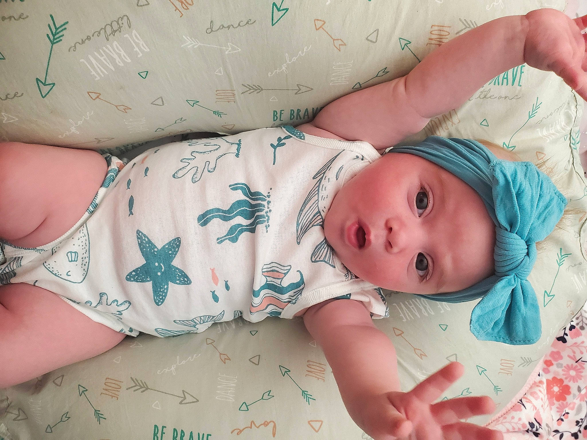 Lakeleigh is registered to the contest to win money with this photo: arm, baby, baby_toddler_clothing, cheek, chest, child, comfort, eye, eyelash, finger, hand, headgear, headwear, human_body, mouth, muscle, person, pink, skin, textile