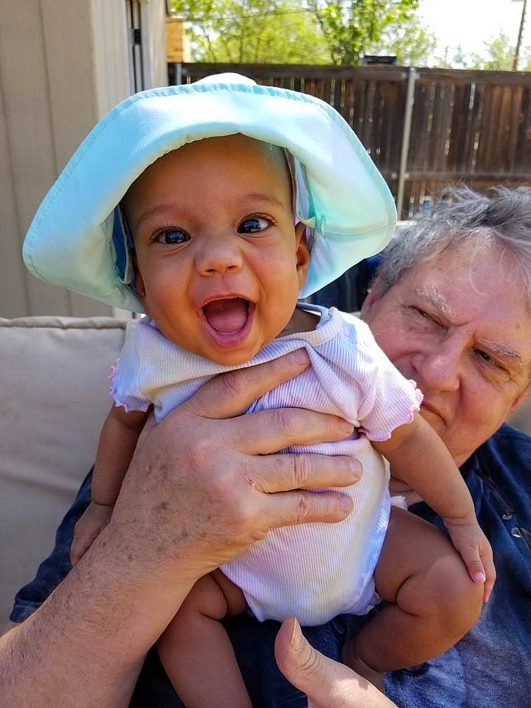 Laylah joined the competition — help win amazing prizes! baby, baby_toddler_clothing, child, face, finger, fun, gesture, grass, hand, happy, hat, headwear, mouth, person, pink, product, skin, smile, summer, sun_hat