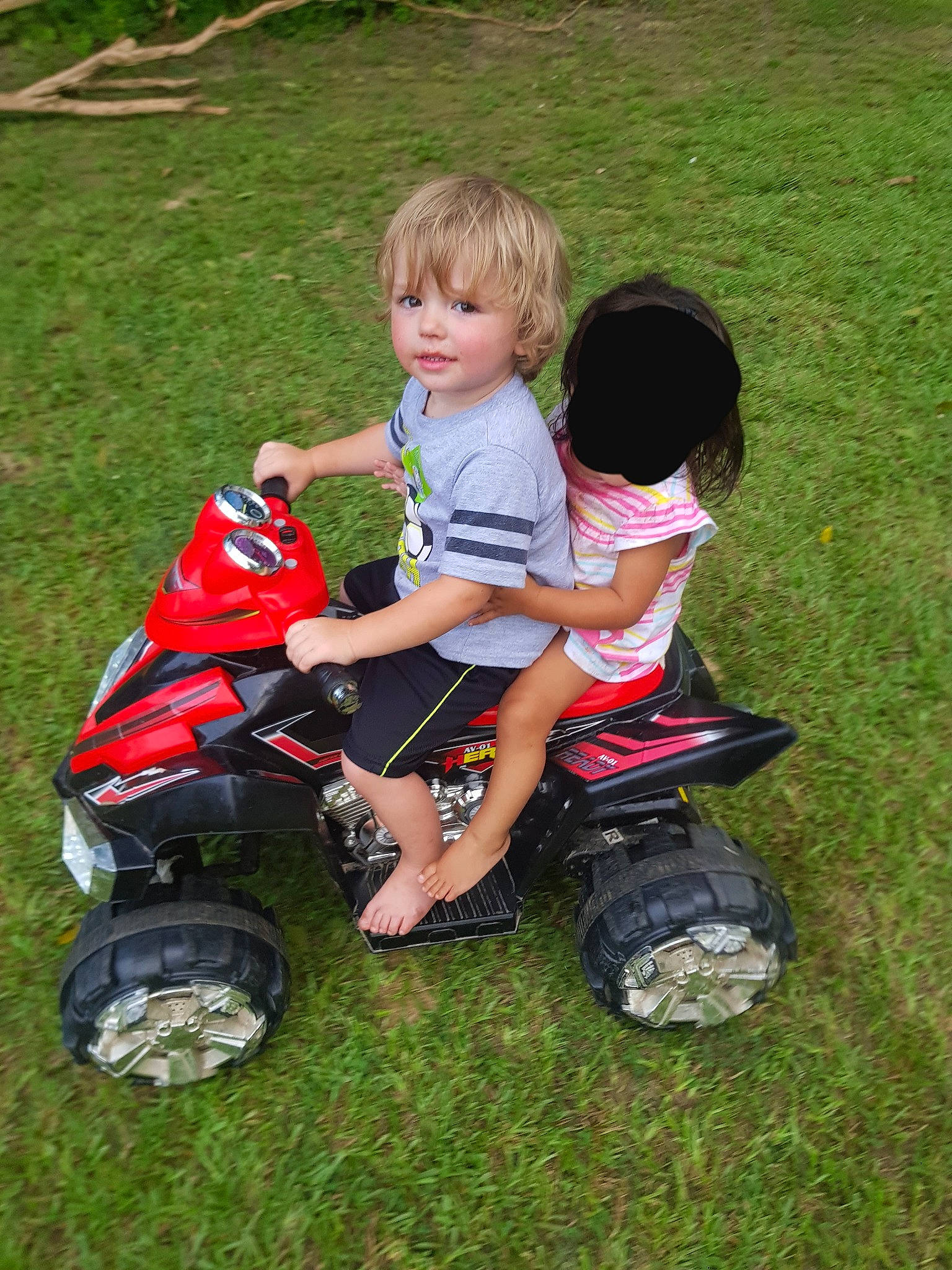 Brennan joined the competition — help win amazing prizes! car, child, grass, lawn, person, play, riding_toy, toddler, vehicle