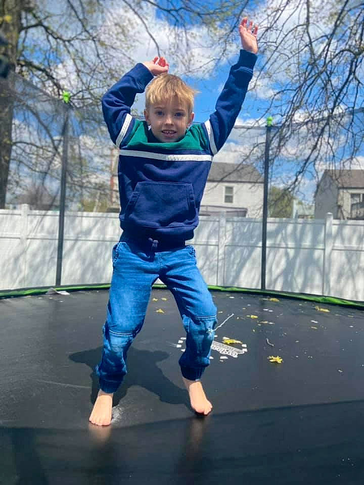 Keith is registered to the contest to win money with this photo: barefoot, cloud, denim, electric_blue, entertainment, event, fun, happy, leisure, performing_arts, person, recreation, sky, sportswear, t_shirt, toddler, trampoline, trampolining, trampolining_equipment_and_supplies, tree