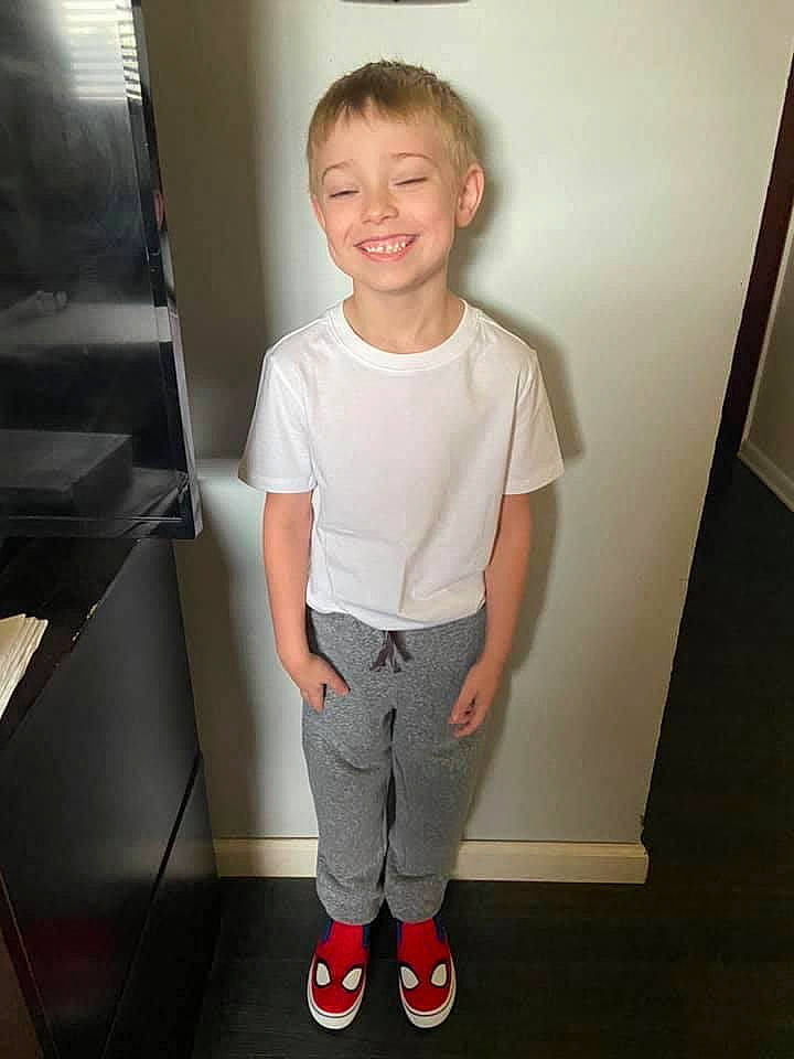 Keith is registered to the contest to win money with this photo: baby_toddler_clothing, child, chin, elbow, face, floor, flooring, hair, head, joy, knee, leg, neck, person, shoulder, sleeve, smile, standing, t_shirt, toddler