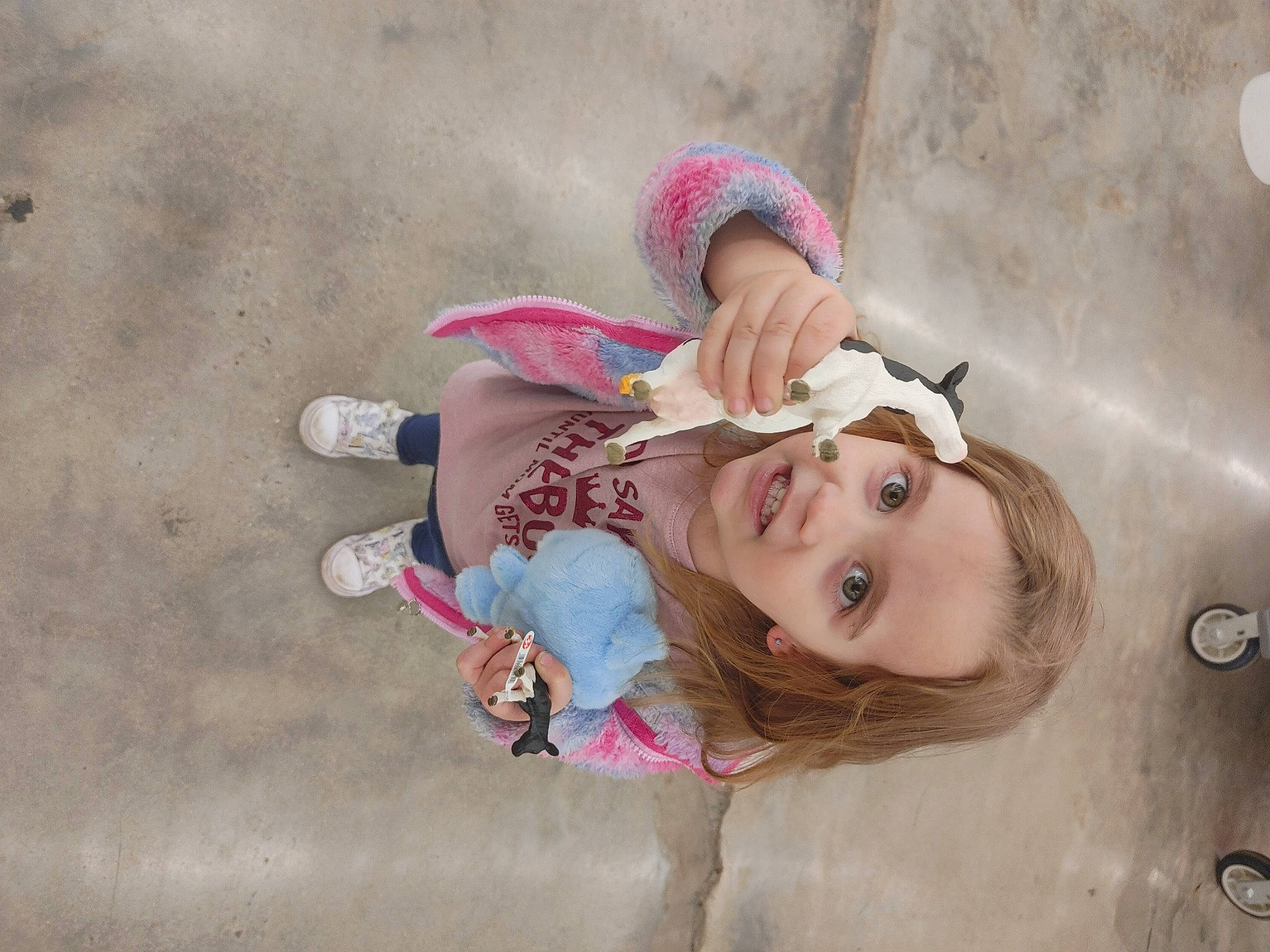 Lexi is registered to the contest to win money with this photo: bangs, child, eyelash, eyewear, fashion_accessory, fun, happy, hat, human_leg, leisure, magenta, person, pink, portrait_photography, recreation, sitting, skin, smile, toddler