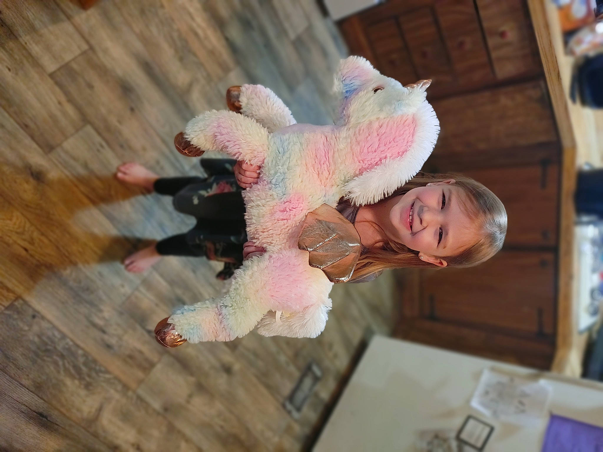 Shayleigh is registered to the contest to win money with this photo: baby, child, costume, event, flooring, fun, fur, happy, hardwood, joy, leisure, person, room, smile, toddler, tree, wood, wood_flooring