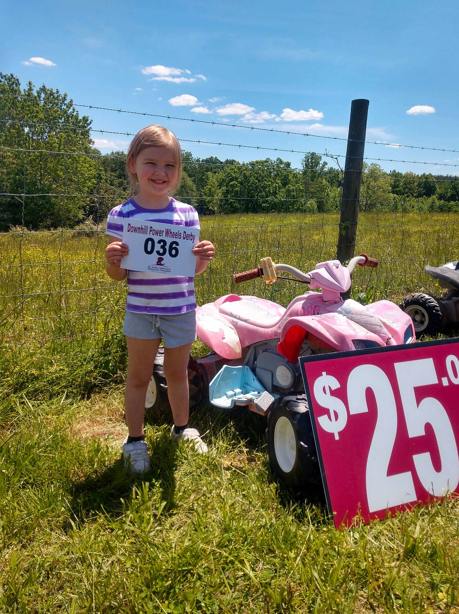 Shayleigh joined the competition — help win amazing prizes! automotive_exterior, automotive_tire, automotive_wheel_system, cloud, fun, grass, grassland, joy, lawn, motor_vehicle, people_in_nature, person, plant, recreation, shorts, sky, t_shirt, tire, toddler, tree