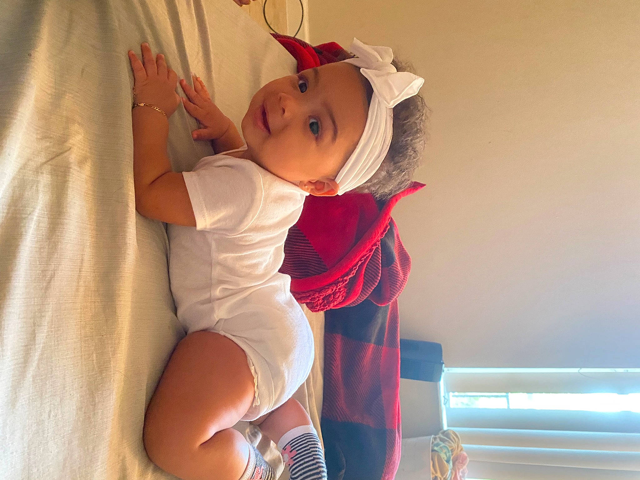 Jazmyn is registered to the contest to win money with this photo: abdomen, baby, baby_toddler_clothing, chest, comfort, elbow, event, fashion_design, happy, hat, head, headwear, human_leg, knee, leg, person, sleeve, sock, thigh, toddler