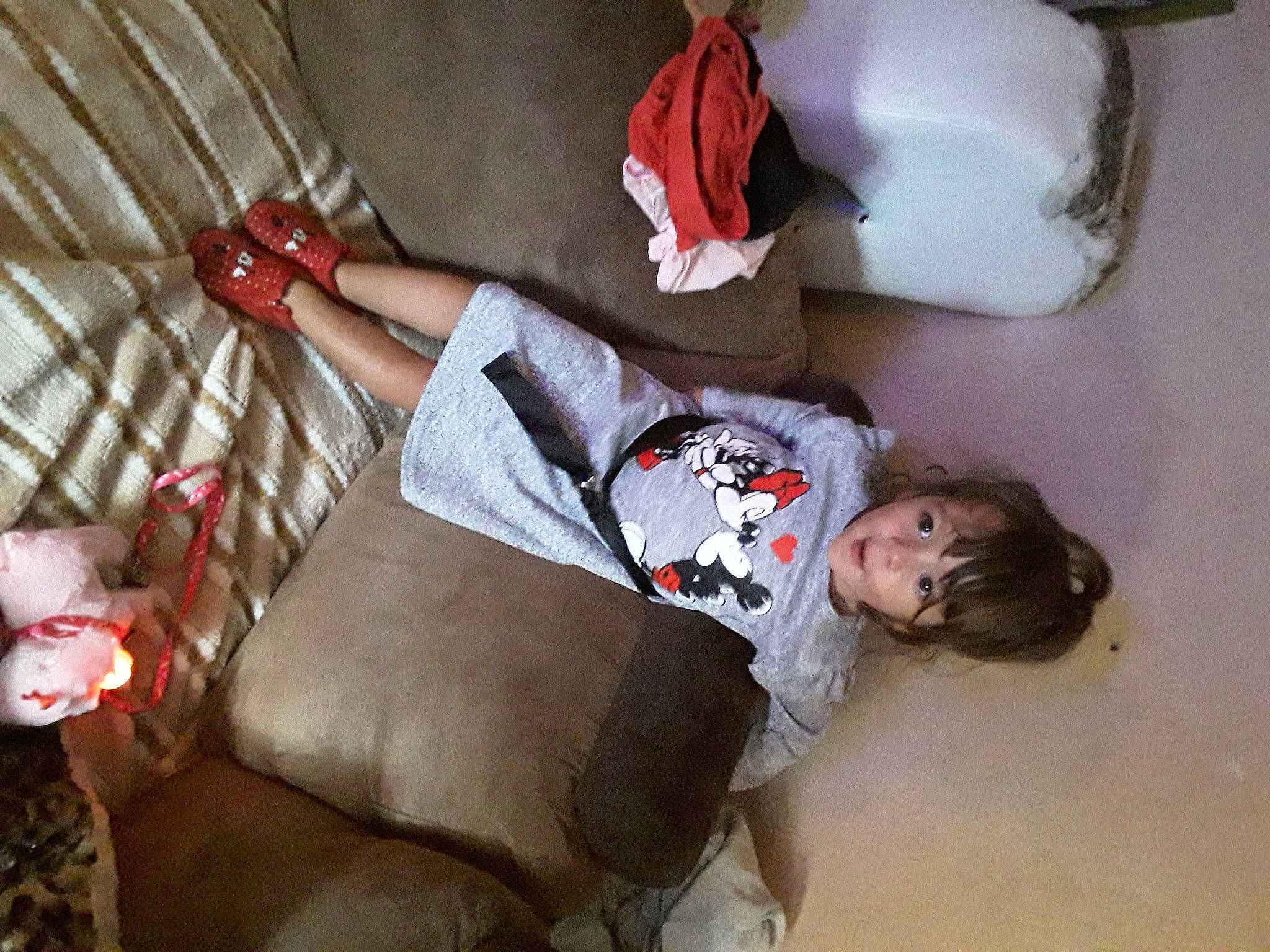 Lyana participe au concours pour gagner de l'argent avec cette photo : baby, baby_toddler_clothing, carmine, child, christmas, comfort, couch, flesh, fur, human_leg, lap, linens, person, pillow, red, room, sitting, sock, textile, thigh