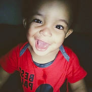 Aquarius joined the competition — help win amazing prizes! toddler, child, smiling, red_shirt, mickey_mouse, face, portrait, happy, indoors, closeup, cute, young_child, person, dark_background, playful, expression, casual_clothing, baby, cheerful, young