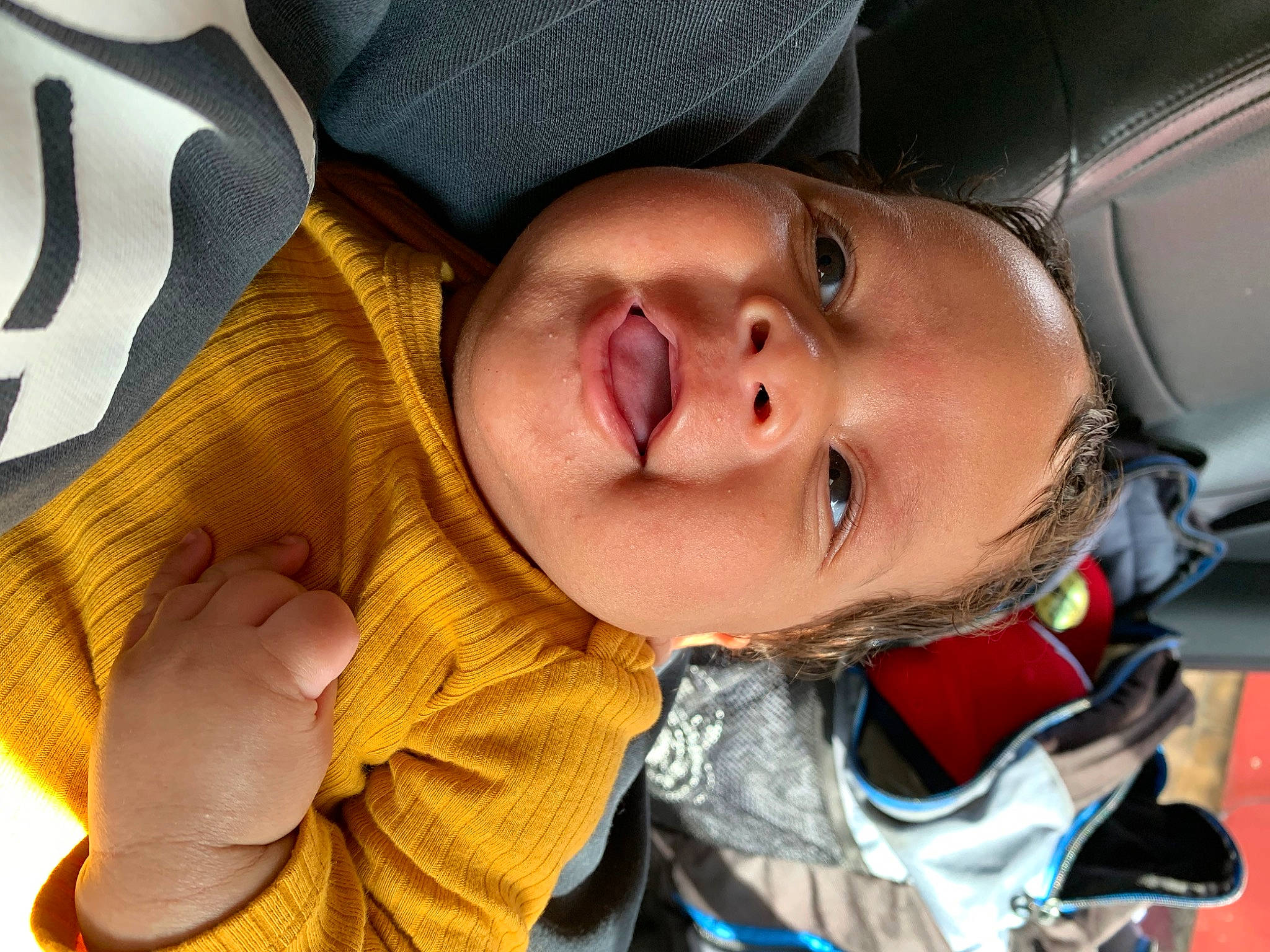 Winston is registered to the contest to win money with this photo: baby, car_seat, cheek, child, chin, comfort, eye, eyebrow, eyelash, eyewear, fun, happy, head, lip, mouth, nose, person, personal_luxury_car, skin, smile