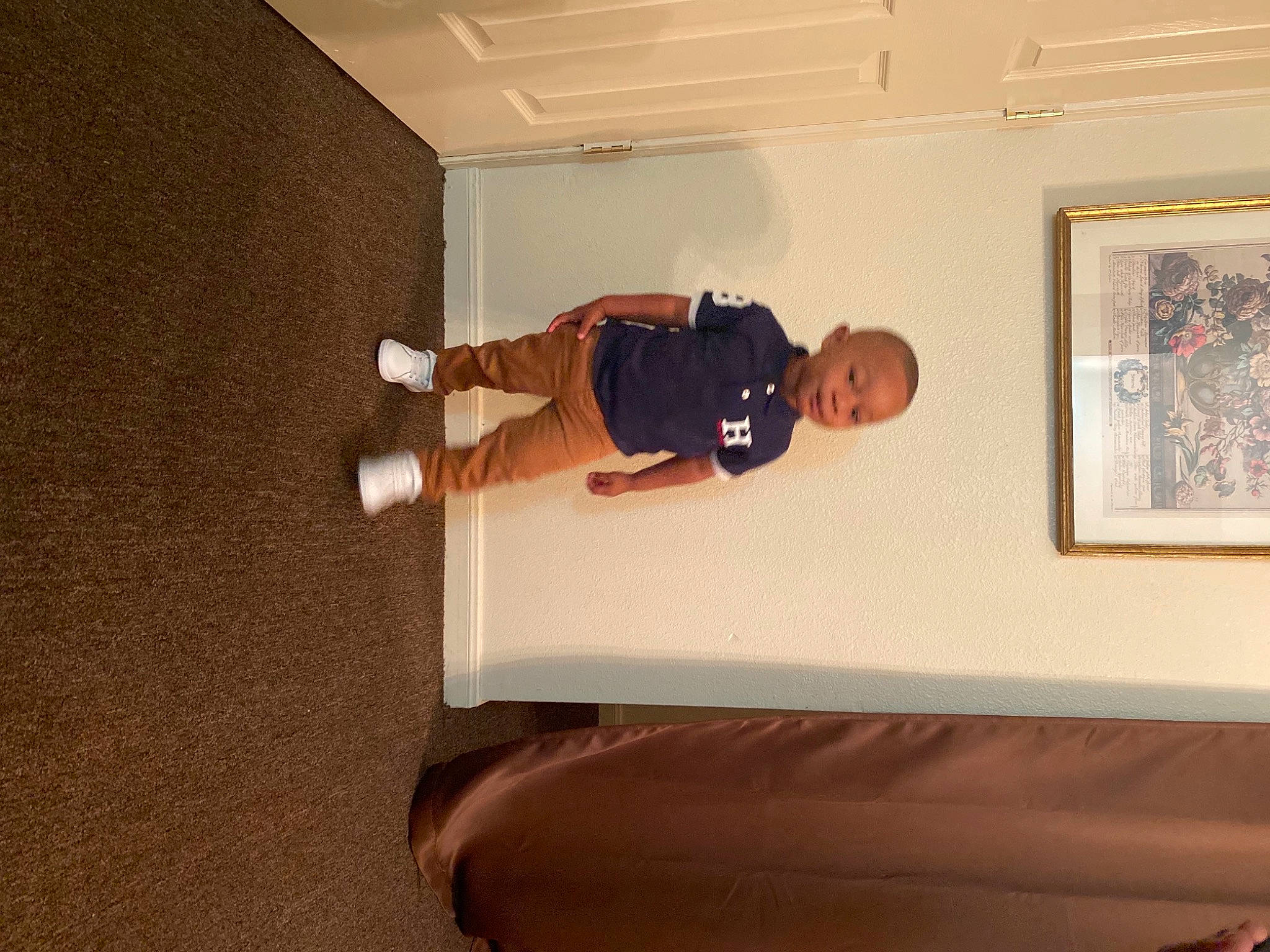 Malik Gardner is registered to the contest to win money with this photo: art, ceiling, comfort, elbow, floor, flooring, hardwood, house, knee, person, picture_frame, plaster, plywood, rectangle, room, shorts, t_shirt, wood, wood_flooring, wood_stain