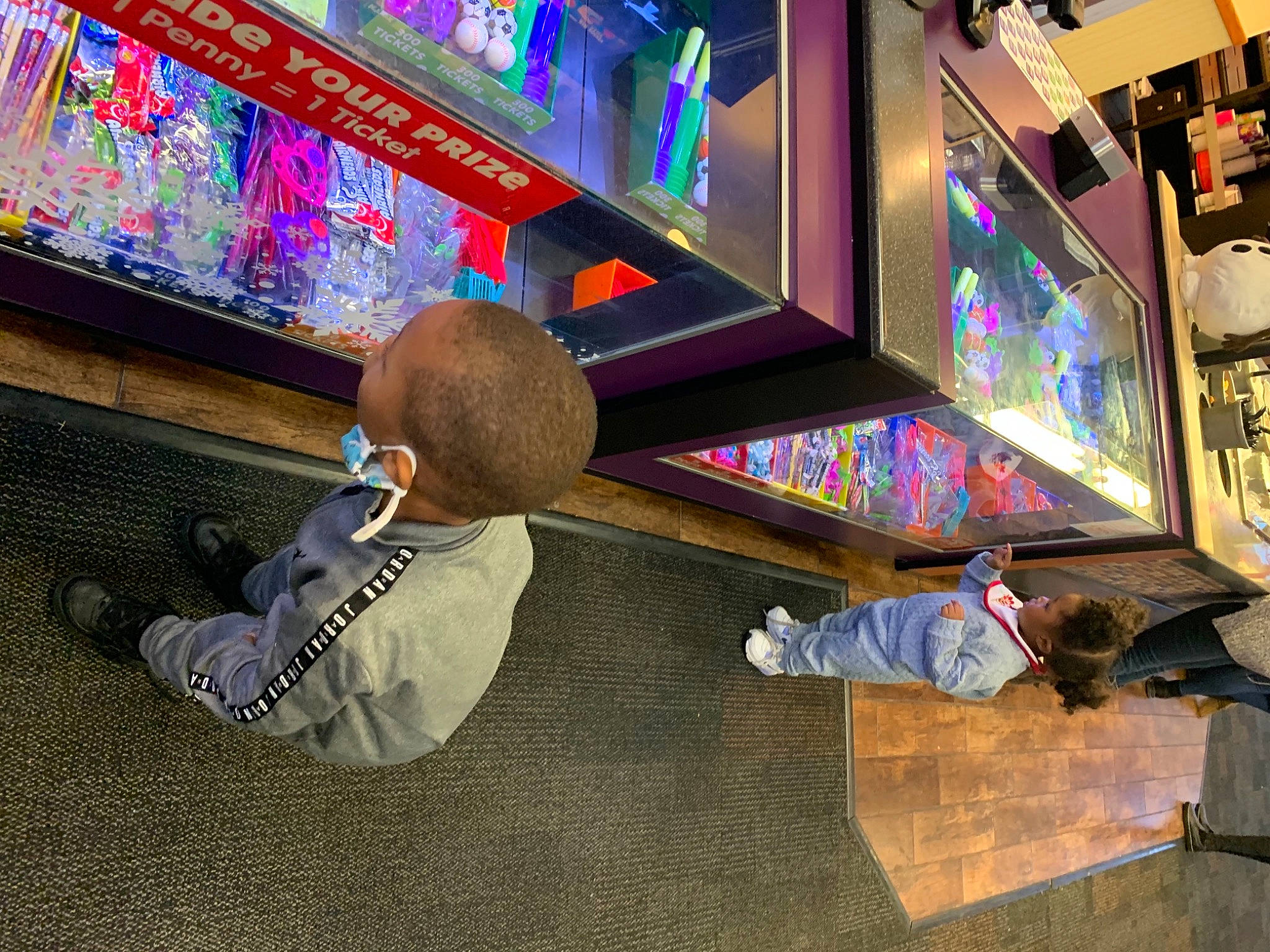 Malik Gardner is registered to the contest to win money with this photo: art, bowler, display_device, electronic_device, flooring, fun, games, indoor_games_and_sports, leisure, machine, pc_game, person, play, recreation, recreation_room, room, space, technology, television_set, video_game_software